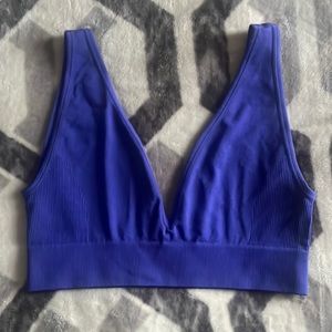 Brand New Weworewhat sports bra. Beautiful blue/purple color. Size medium
